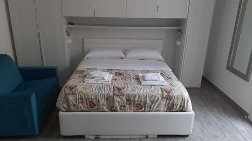 Ένα ή περισσότερα κρεβάτια σε δωμάτιο στο Hotel Riviera Sanremo