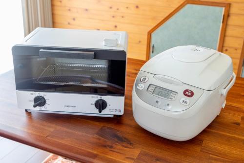 a toaster oven sitting on top of a table at 湯庵 完全貸し切り庭付き in Matsue