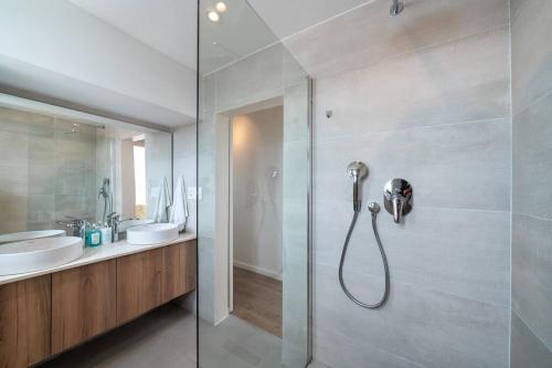 a bathroom with a shower and a sink at Perfect beach-side condo in Sea Point, Cape Town with ocean view in Cape Town