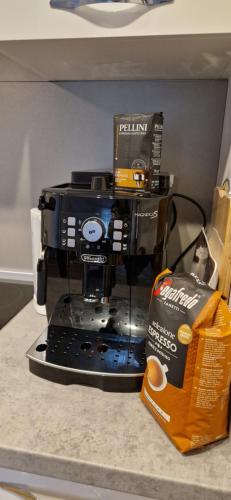 a coffee maker sitting on a counter next to a box at Apartment Ivana in Malinska