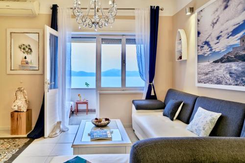 a living room with a couch and a table at Holiday Home Labineca in Gradac