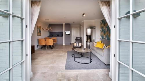 a living room with a couch and a table at ApartHotel Seepferdchen in Hörnum