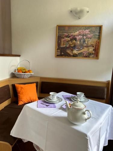a table with a tea set on top of it at Guesthouse Klečak in Cavtat
