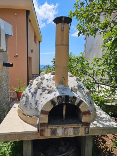 a pizza oven sitting on top of a table at Medin Apartments BluVista in Petrovac na Moru