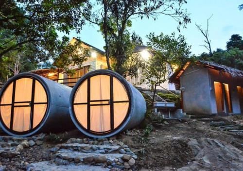 a house shaped like a circle with a round window at Time Capsule Retreat, Sungai Lembing in Sungai Lembing