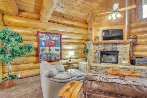 a living room with a fireplace and a tv at Royal Views - Private Mountain Top Cabin cabin in Gatlinburg
