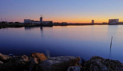 a view of a large body of water with rocks at Alla Scaletta in Trapani