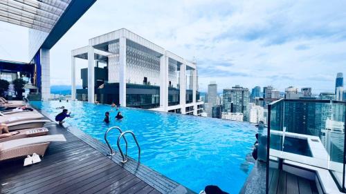 a large swimming pool on top of a building at Platinum Suites KLCC in Kuala Lumpur