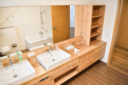 a bathroom with a sink and a mirror at Burg Hotel Feldberg in Feldberg