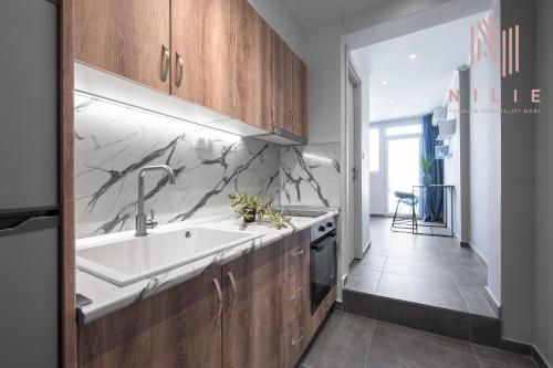 a kitchen with a sink and a counter top at V1 Penthouse, Nilie Hospitality MGMT in Thessaloniki