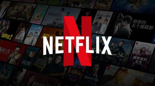a bunch of movies on a wall with the word netflix at Chambre déplacement professionnel in Zilling