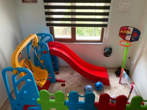 a childs play room with a slide and play equipment at Sümela Monastery & Hamsikoy Apart Hotel in Trabzon