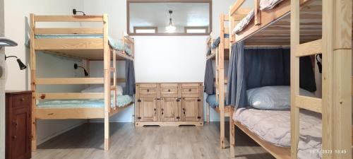 a room with two bunk beds and a desk at PRENOČIŠČE 9a in Tolmin