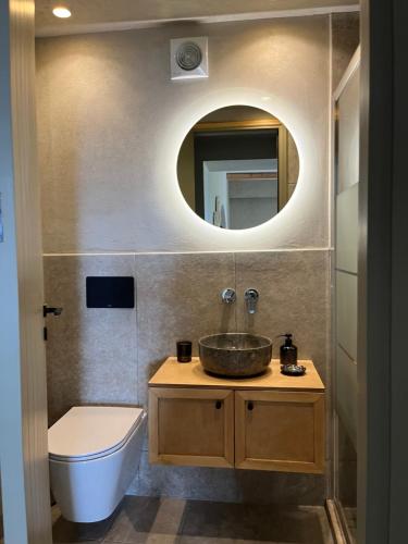 a bathroom with a sink and a mirror at Petrichor in Kalamata