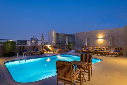 a pool on the rooftop of a hotel at City Stay Prime Hotel Apartments - Al Barsha in Dubai