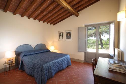 Кровать или кровати в номере Agriturismo Podere La Casa