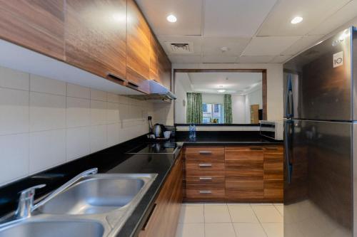 Kuchyň nebo kuchyňský kout v ubytování City Stay Prime Hotel Apartments - Al Barsha