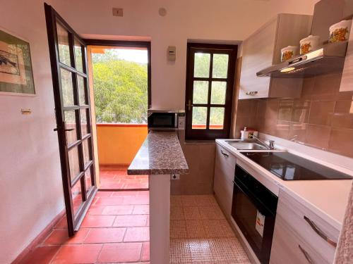 a kitchen with a sink and a counter top at Appartamento con vista mare a Terramala in Terra Mala