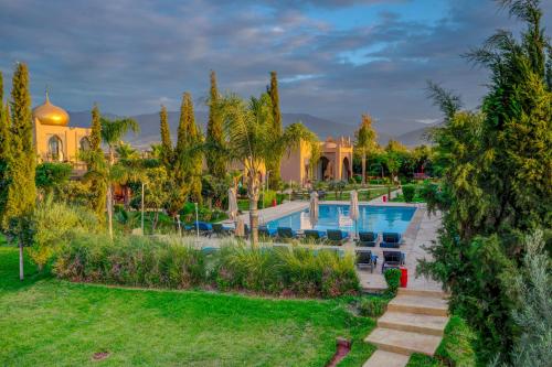 an aerial view of a villa with a swimming pool at Taj Atlas Wellness Boutique Hôtel & Spa in Amizmiz