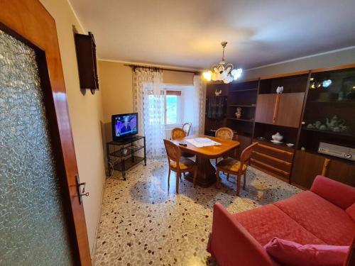 a living room with a table and a couch at Nonna Dorina in Pietrabbondante