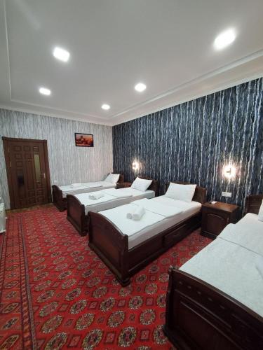 Postel nebo postele na pokoji v ubytování Nursultan Grand Guest House