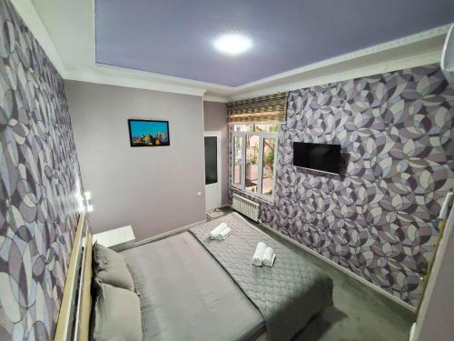 TV a/nebo společenská místnost v ubytování Nursultan Grand Guest House