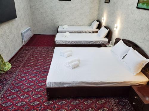 Postel nebo postele na pokoji v ubytování Nursultan Grand Guest House