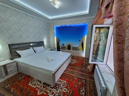 Postel nebo postele na pokoji v ubytování Nursultan Grand Guest House