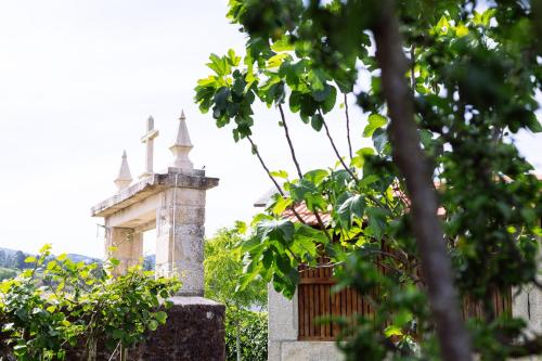 a building with a cross on top of it at Quinta da Carvalhosa in Cabeceiras de Basto