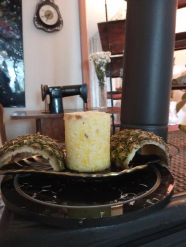 a piece of cake on a plate with a pineapple at Garden Village Home in Ayvalık