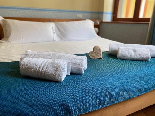 Postel nebo postele na pokoji v ubytování Residenza d'Epoca Albergo Grimani