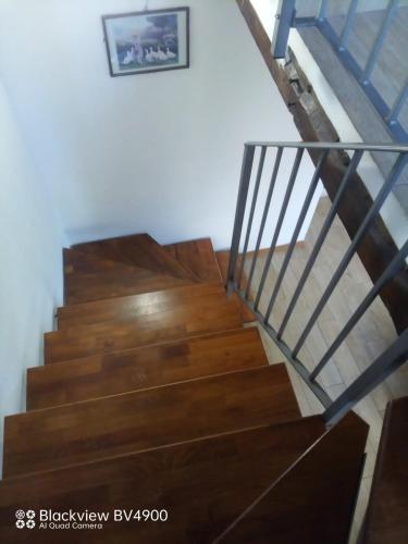 a staircase in a house with wooden floors at Segarati Relax Ca Perdissi in Bardi