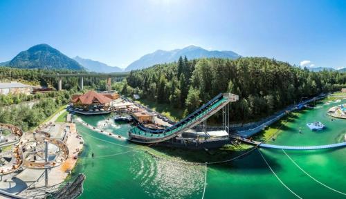 an amusement park with a slide in the water at Pension Alpina in Roppen