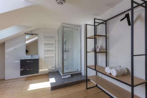 a bathroom with a shower and a sink at Villa Misano in Le Mans