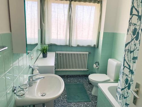 a bathroom with a sink and a toilet at Vivere a Locarno - 5 minuti da Piazza Grande in Locarno
