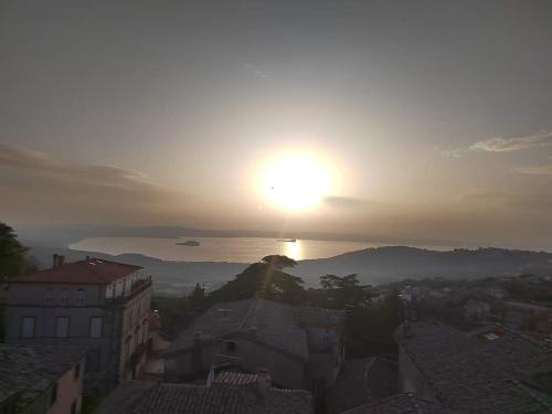 a view of the sun rising over a city at Dan House in Montefiascone