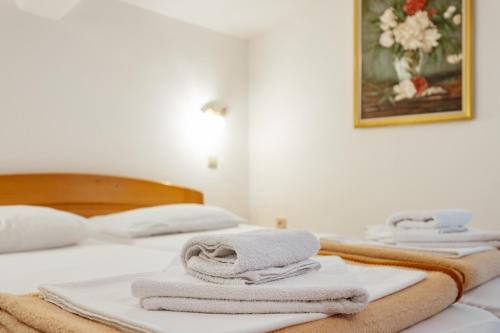 Cama o camas de una habitación en Radic Rooms
