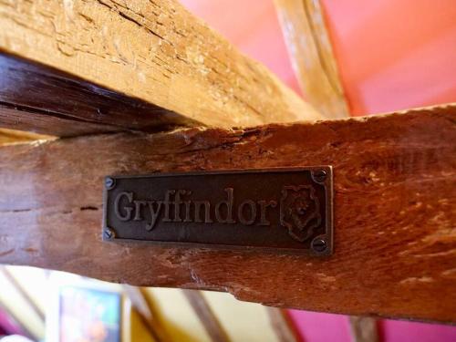 a sign on the side of a wooden door with the word giviminator at Huge Luxury 8 Bed Manor House Hot Tub Pool Table in Saffron Walden