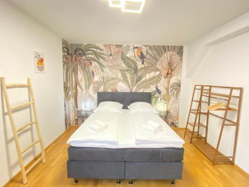 En eller flere senge i et værelse på LUXOMES: Tropical Style - Old Town - Central Ingolstadt