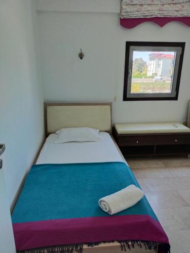 Katil atau katil-katil dalam bilik di Cozy and Peaceful Apartment In the Belek Center