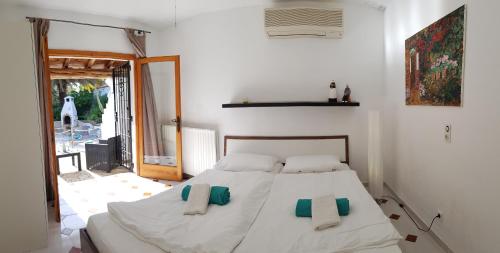 Postel nebo postele na pokoji v ubytování private Villa mit eigenem Pool unter Palmen