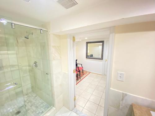 a bathroom with a shower and a walk in shower at COMFY Basement Home 2 Bdrm1Den 3Queen Beds in Washington, D.C.