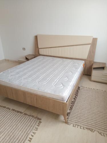 מיטה או מיטות בחדר ב-Residence de la plage