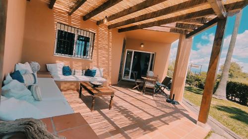 a patio with a couch and a table at Manilva Beach 140 in Manilva
