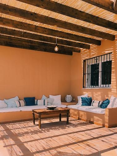 a living room with two couches and a table at Manilva Beach 140 in Manilva