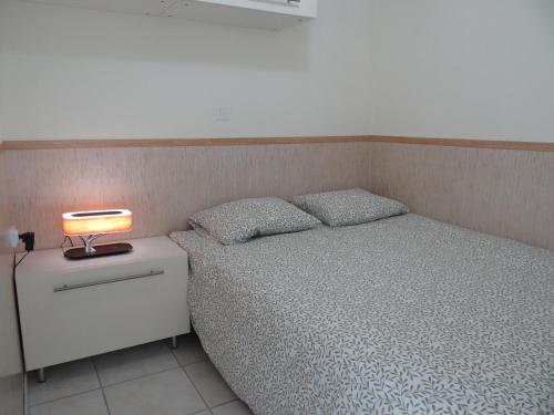מיטה או מיטות בחדר ב-PISO MILU