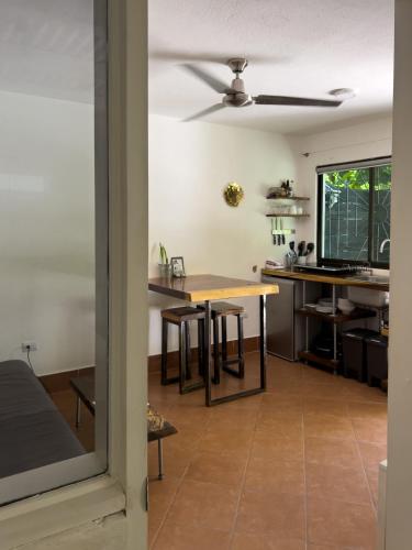a kitchen and dining room with a table at Salt Nosara in Nosara