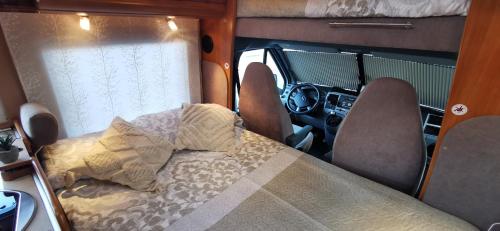 a small room with a bed in an rv at AutoVan IBZ in Sant Josep de sa Talaia