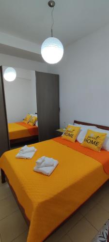 a bedroom with two beds with towels on them at La casetta di Virginia in Naples