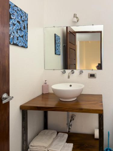 a bathroom with a sink and a mirror at Salt Nosara in Nosara